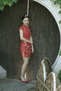 Chinese cheongsam model in Chinese classical garden