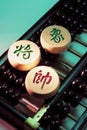 Chinese Chess Pieces on Abacus Royalty Free Stock Photo