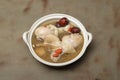 Chinese chicken soup has herb on wood table Royalty Free Stock Photo