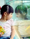 chinese child Looking in the mirror Royalty Free Stock Photo