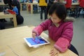 Chinese child playing ipad