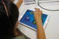 Chinese child playing ipad