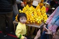 A Chinese child is visiting the new year market