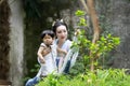 Chinese classic woman in Hanfu dress enjoy free time with baby and close friends Royalty Free Stock Photo