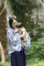 Chinese classic woman in Hanfu dress enjoy free time with baby and close friends Royalty Free Stock Photo