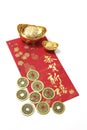 Chinese Coins and Gold Ingots on Red Packet Royalty Free Stock Photo