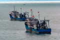 Chinese commercial trawlers anchored on the outer anchorage. Royalty Free Stock Photo