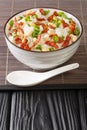 Chinese cooking, congee jook boiling jasmine rice with a lot of water over low heat with the addition of bacon, peanuts and Royalty Free Stock Photo