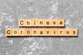 Chinese coronavirus word written on wood block. text on wooden table for your desing, Wuhan chinese Coronavirus, 2019-nCoV.