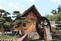 Chinese cottage and waterwheel Royalty Free Stock Photo