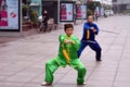 Chinese couple practice Tai Chi in Nanjing Road Shanghai China