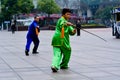 Chinese couple practice Tai Chi in Nanjing Road Shanghai China