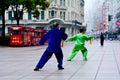 Chinese couple practice Tai Chi in Nanjing Road Shanghai China