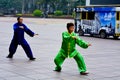 Chinese couple practice Tai Chi in Nanjing Road Shanghai China