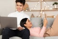 Chinese Couple Relaxing Watching Movie And Reading Book At Home Royalty Free Stock Photo