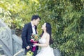 A Chinese couple`s wedding photo who stand on a stone ancient bridge in shui bo park in Shanghai Royalty Free Stock Photo
