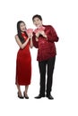 Chinese couple wear cheongsam holding angpao Royalty Free Stock Photo