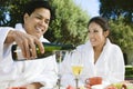 Chinese Couple Wearing Bathrobes Drinking Champagne Royalty Free Stock Photo