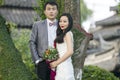 Chinese couple wedding portraint in front of Old trees and old building Royalty Free Stock Photo