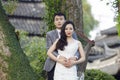 Chinese couple wedding portraint in front of Old trees and old building Royalty Free Stock Photo