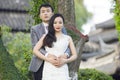 Chinese couple wedding portraint in front of Old trees and old building Royalty Free Stock Photo