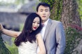 Chinese couple wedding portraint in front of Old trees and old building Royalty Free Stock Photo