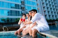 Chinese couples drinking cocktails in hotel pool bar Royalty Free Stock Photo