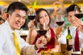 Chinese couples toasting with wine in restaurant Royalty Free Stock Photo