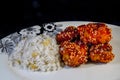 Chinese crispy sesame chicken with rice and corn