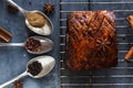 Chinese crispy skin pork belly on dark concrete background with spices, copy space