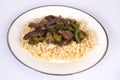 Chinese Cuisine, beef and black bean sauce with egg fried rice against a white background Royalty Free Stock Photo