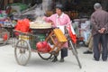 Cooking at a carrier cycle outdoor,Xingping,China