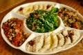 Vegetable salad with crackers, served on a white plate. Beijing, China.