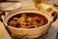 Chinese dish roast in a clay pot with meat and vegetables. Beijing, China