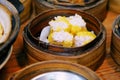 Chinese cuisine Shumai, hot and steamy dim sim or steamed Chinese pork dumplings were set in steamer basket