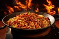 Chinese cuisine. Stir-fried noodles with meat and vegetables in a wok, Experience a flaming spice sensation with sizzling stir- Royalty Free Stock Photo