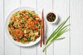 Wok noodles with chicken and tofu on a white plate Royalty Free Stock Photo