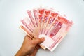 Chinese currency, money, yuan, money fan in hand on a white background, isolate Royalty Free Stock Photo