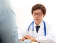 A Chinese doctor in a white lab coat is checking the pulse of a patient Royalty Free Stock Photo