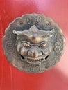 Chinese Door Knob Knocker on Red Wooden Door Royalty Free Stock Photo