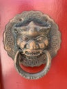 Chinese Door Knob Knocker on Red Wooden Door Royalty Free Stock Photo