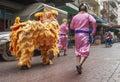 A Chinese dragon in the streets of chinatown in Bangkok, Thailand, performs the lion dance