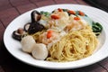 Chinese dried noodle with dumplings, fishballs, and mushrooms