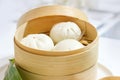 Chinese dumpling steamed buns, Steamed bun served in wooden basket Royalty Free Stock Photo