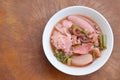 Chinese dumpling stuff minced pork with fish ball and pickled squid in red soup Royalty Free Stock Photo