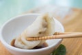 Chinese dumplings or Jiaozi with chopstick