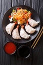 Chinese dumplings jiaozi with shrimps are served with vegetable