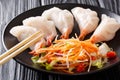 Chinese dumplings jiaozi with shrimps are served with vegetable