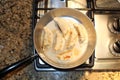 Chinese Dumplings Sizzle in a Frying Pan