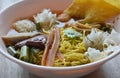 Chinese egg noodle with fish ball and crispy squid in soup Royalty Free Stock Photo